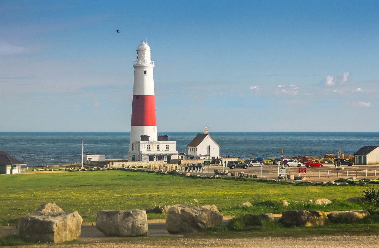 Portland Bill Lighthouse on the end of the cliff