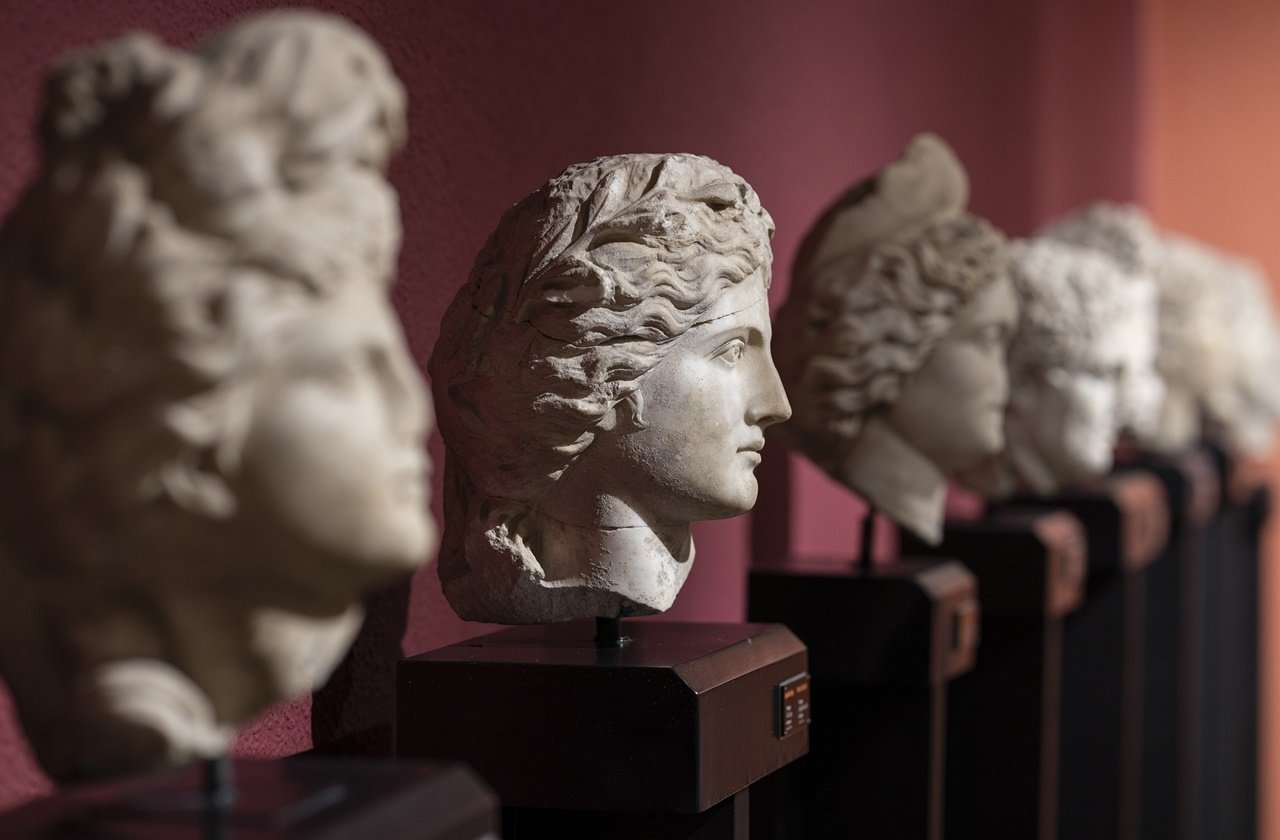 Row of marbled heads at a museum