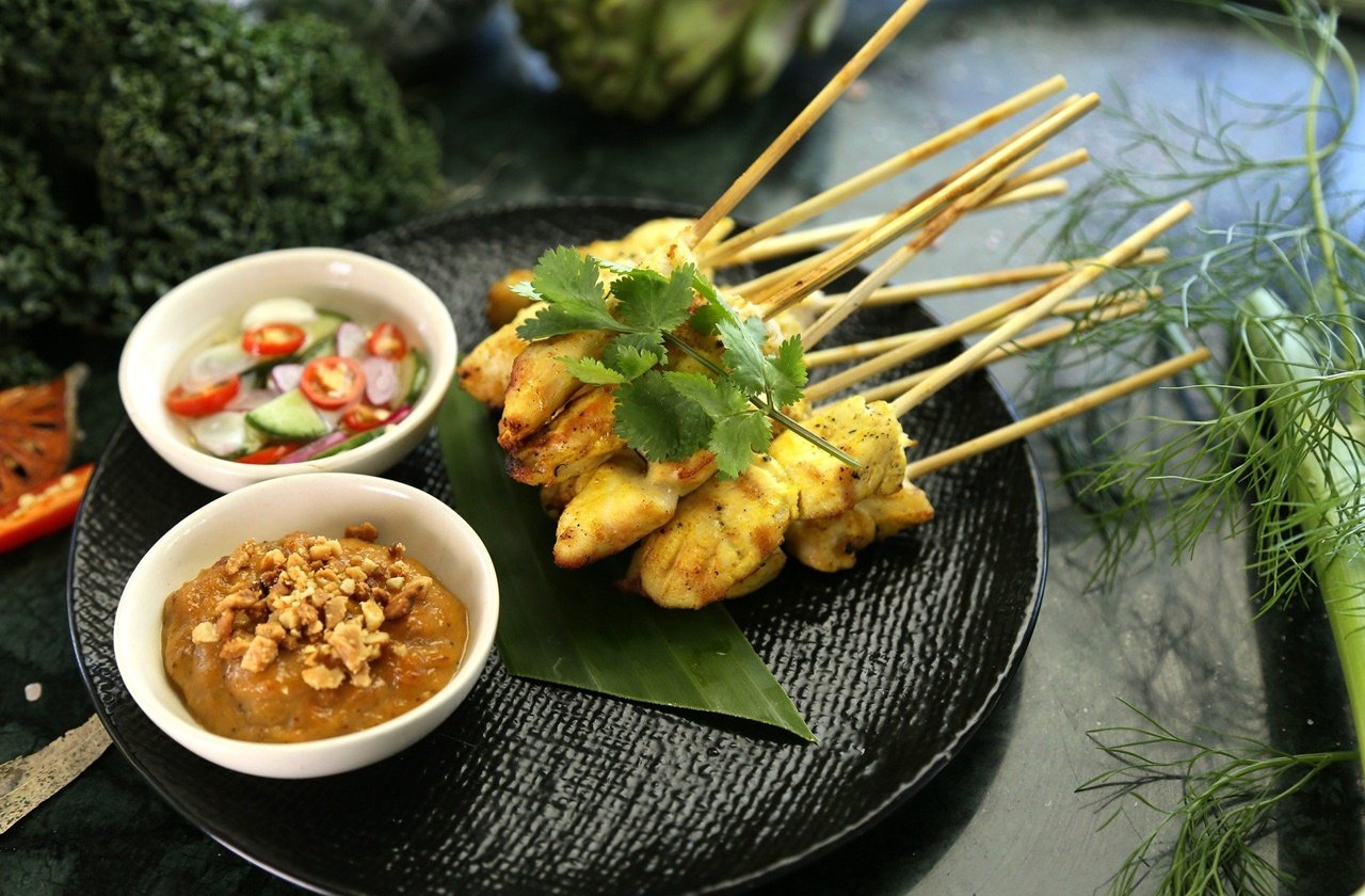 Chicken satay Satay served with peanut sauce and pickled vegetables