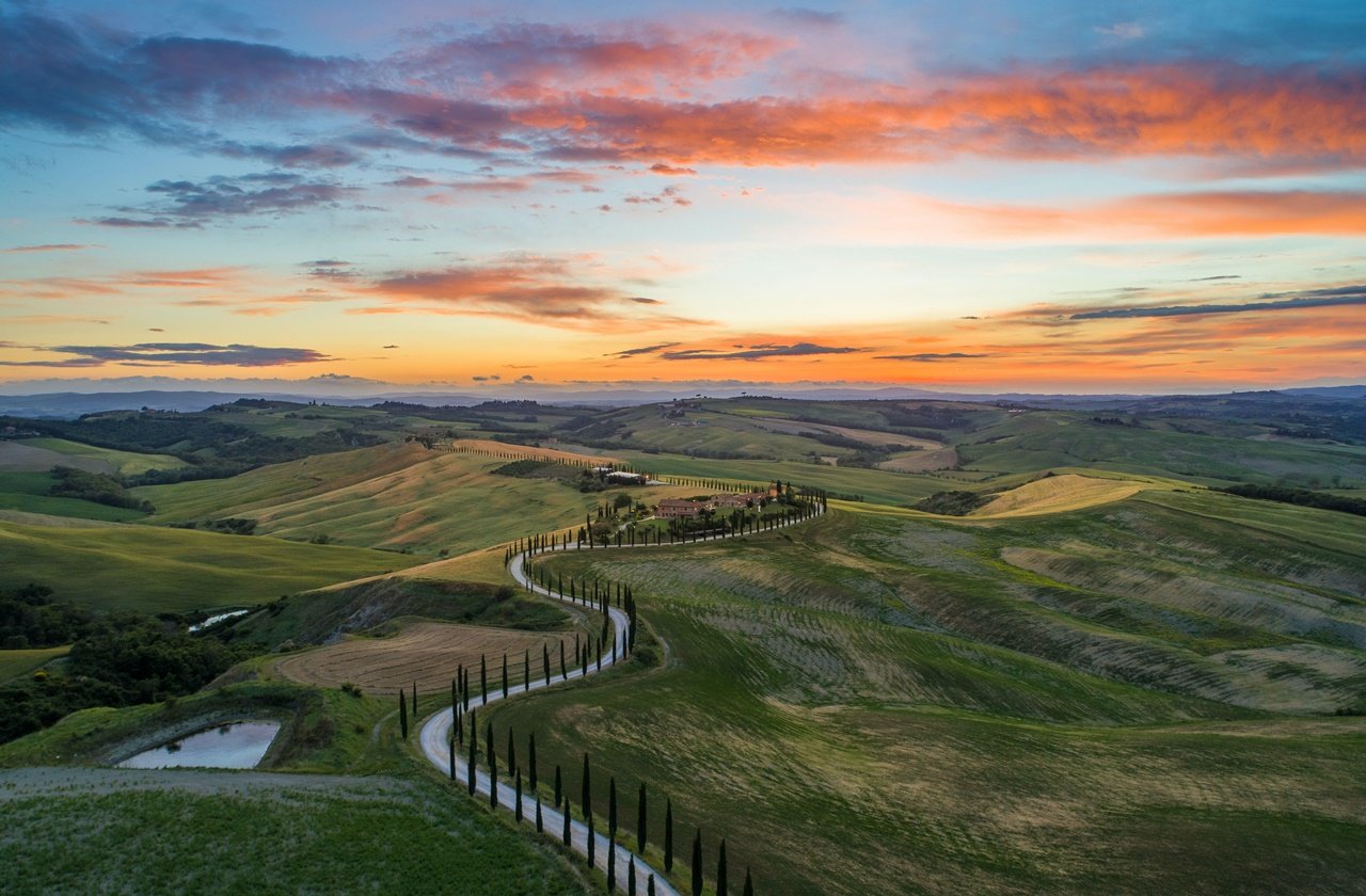 Rolling hills of Tuscany during sunset