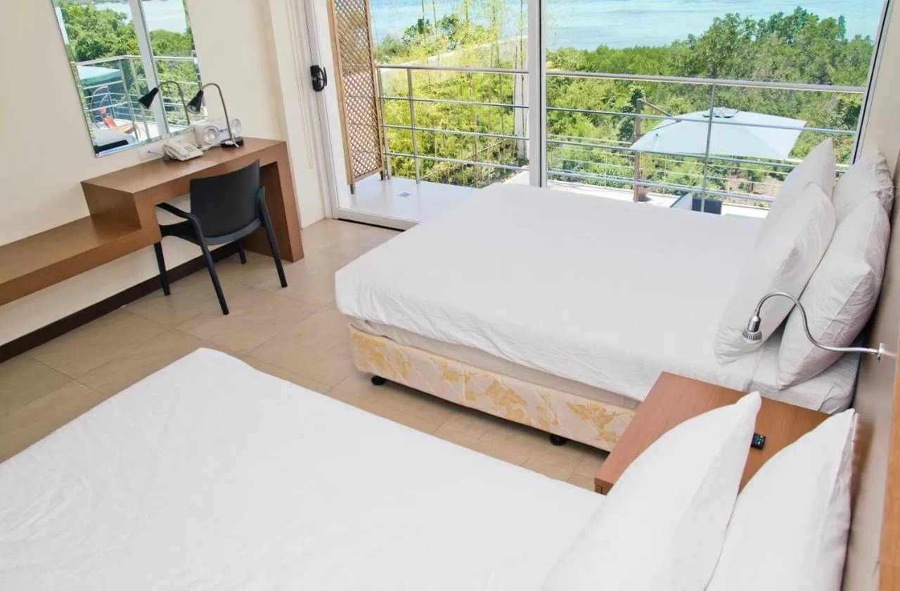 Room with beach views at Ocean Suites Bohol Boutique Hotel
