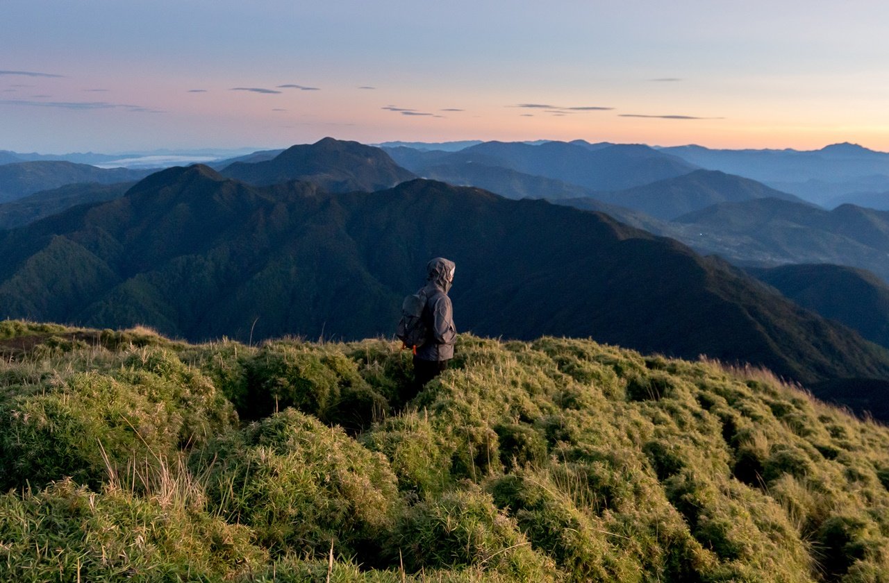 Man hiking down a mountain in the Philippines