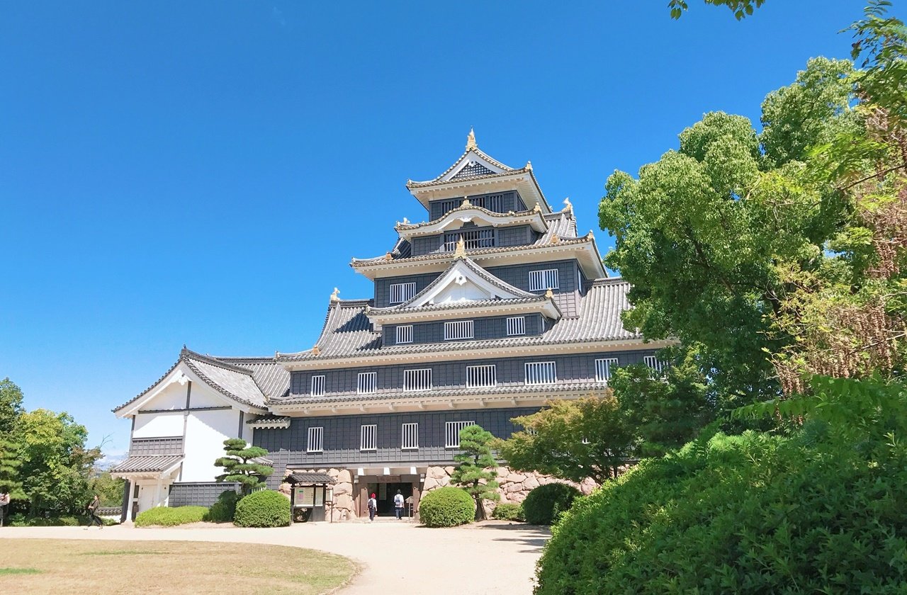 Front view of Okayama Castle during summer