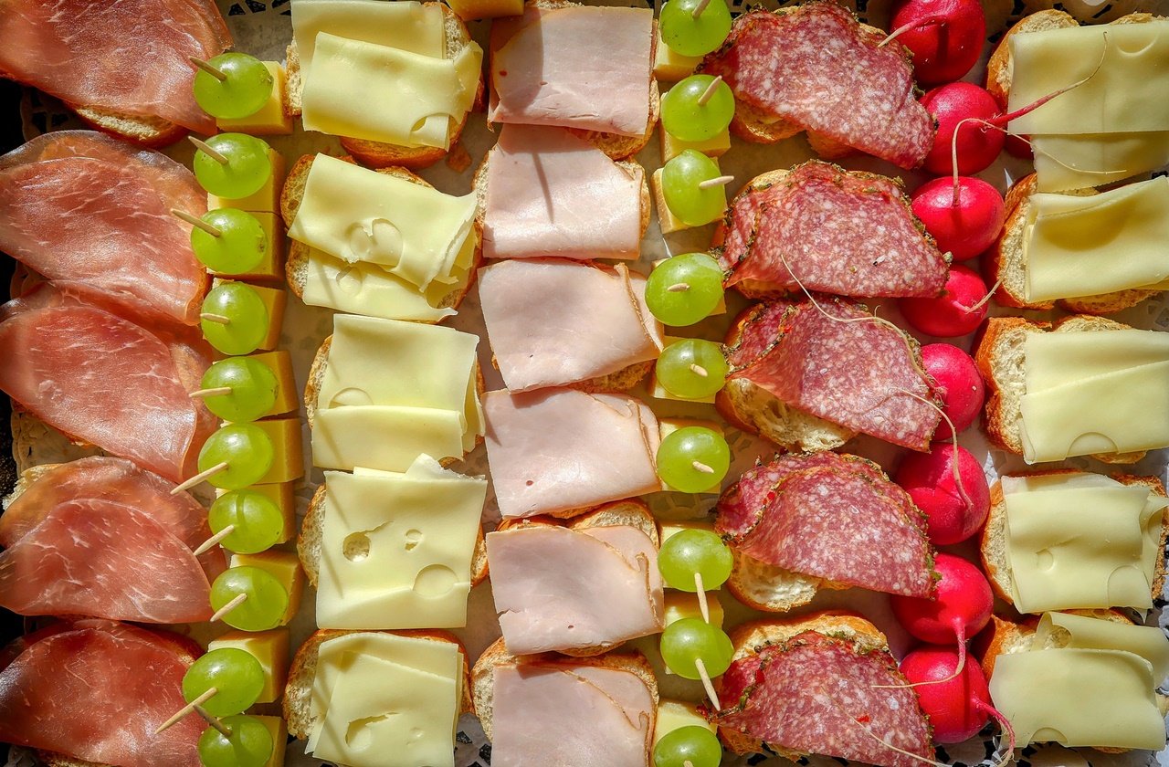 Bologna cured meats Platter of cured meats with fruits and cheese