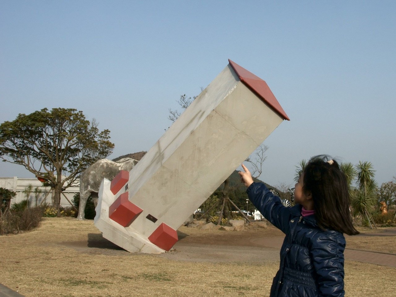 Young girl posing for a photo at Jeju's Trick Art Museum