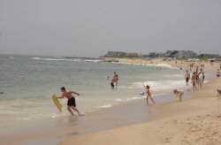 Charlestown Beach Beachgoers running to the shore at Charlestown Town Beach