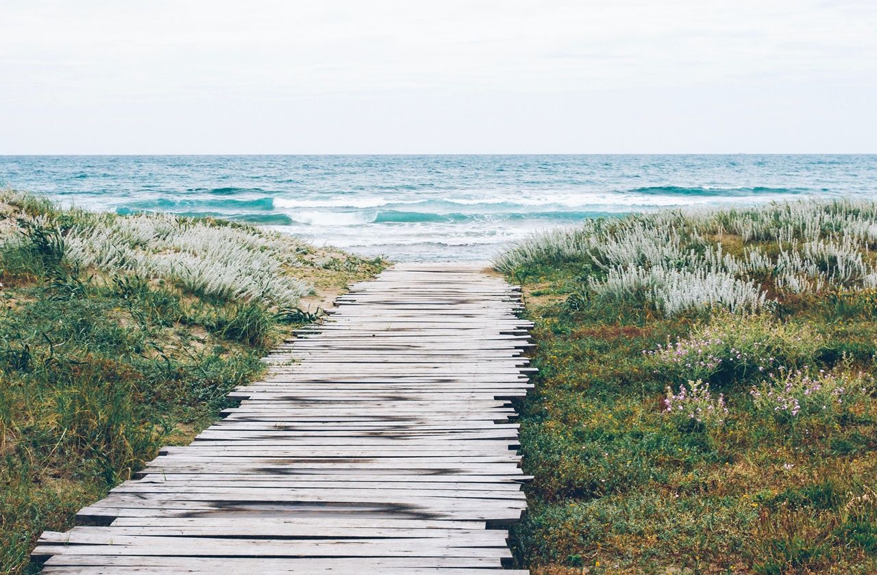 beach wooden pathway leading to the beach